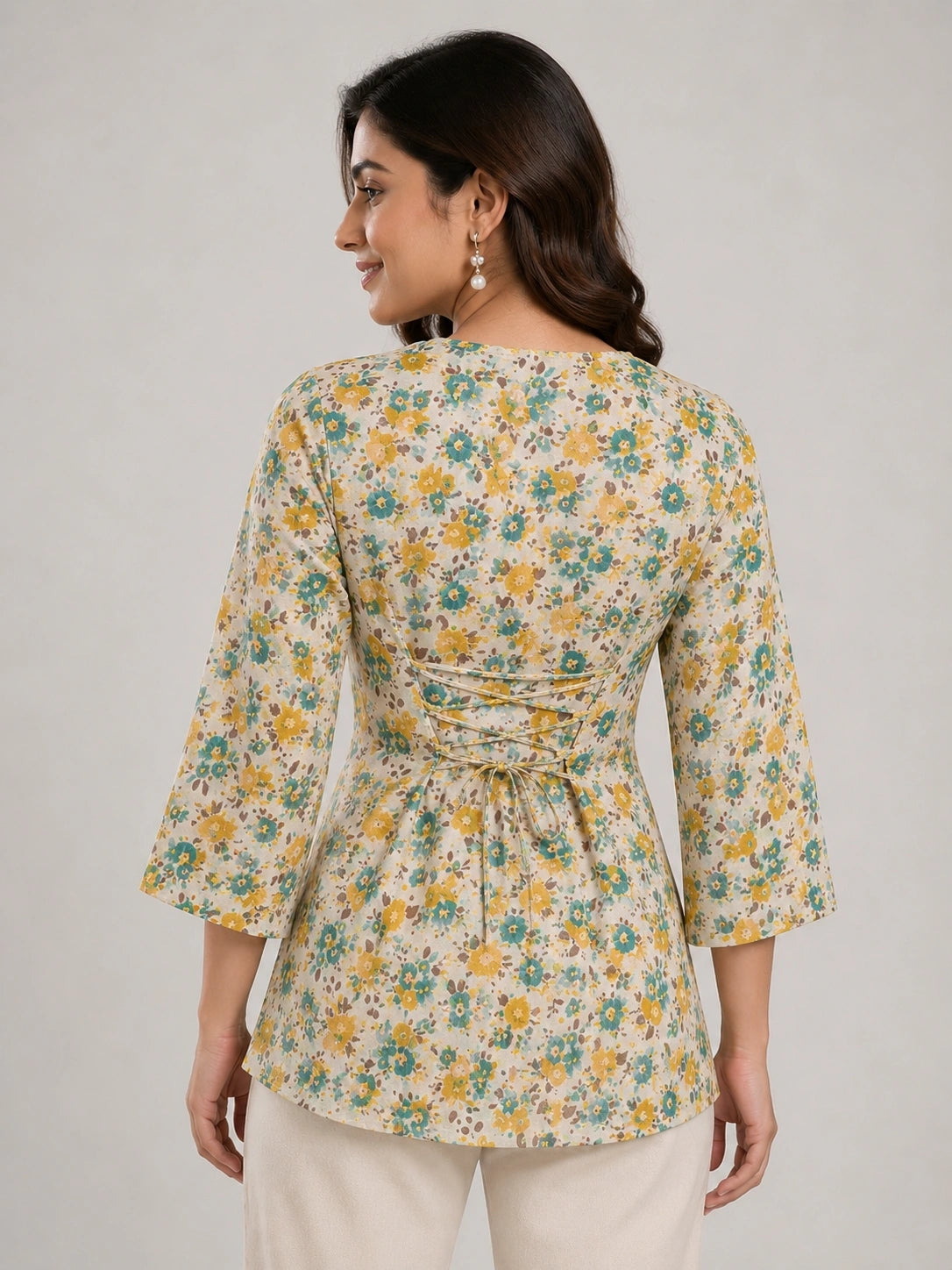 Women's Beige Floral Print Corset Style Short Kurti with V-Neck, Three-Quarter Flared Sleeves and Adjustable Back Tie-Up for Casual Wear